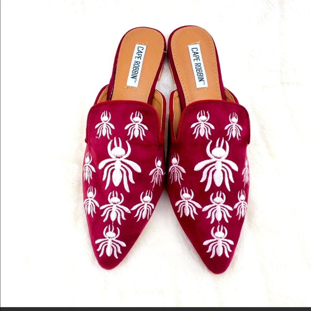 Cape Robbin slip on. Bug embroidery white and red background.